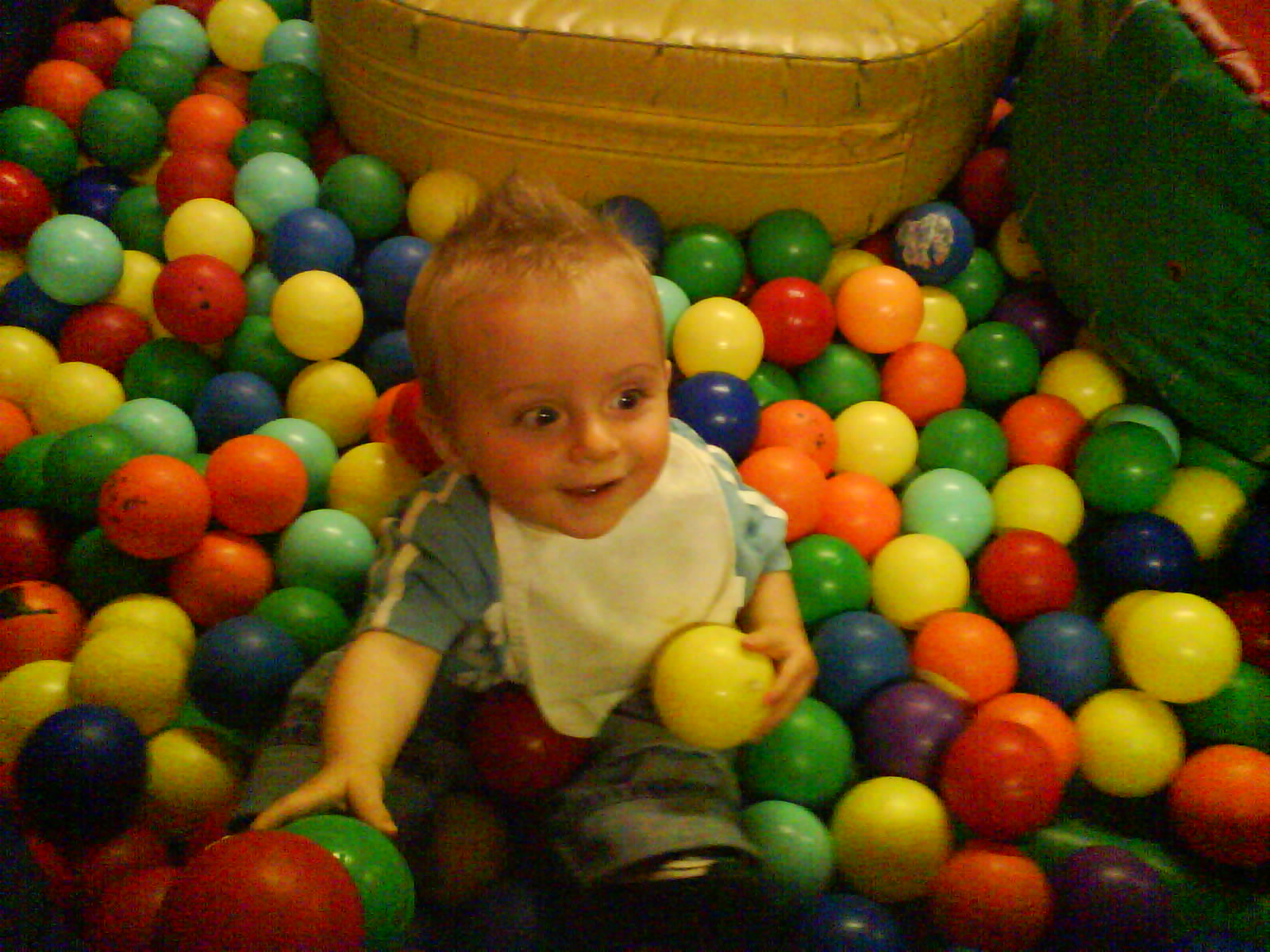 Rhys at 9 months old playing in a ball pit